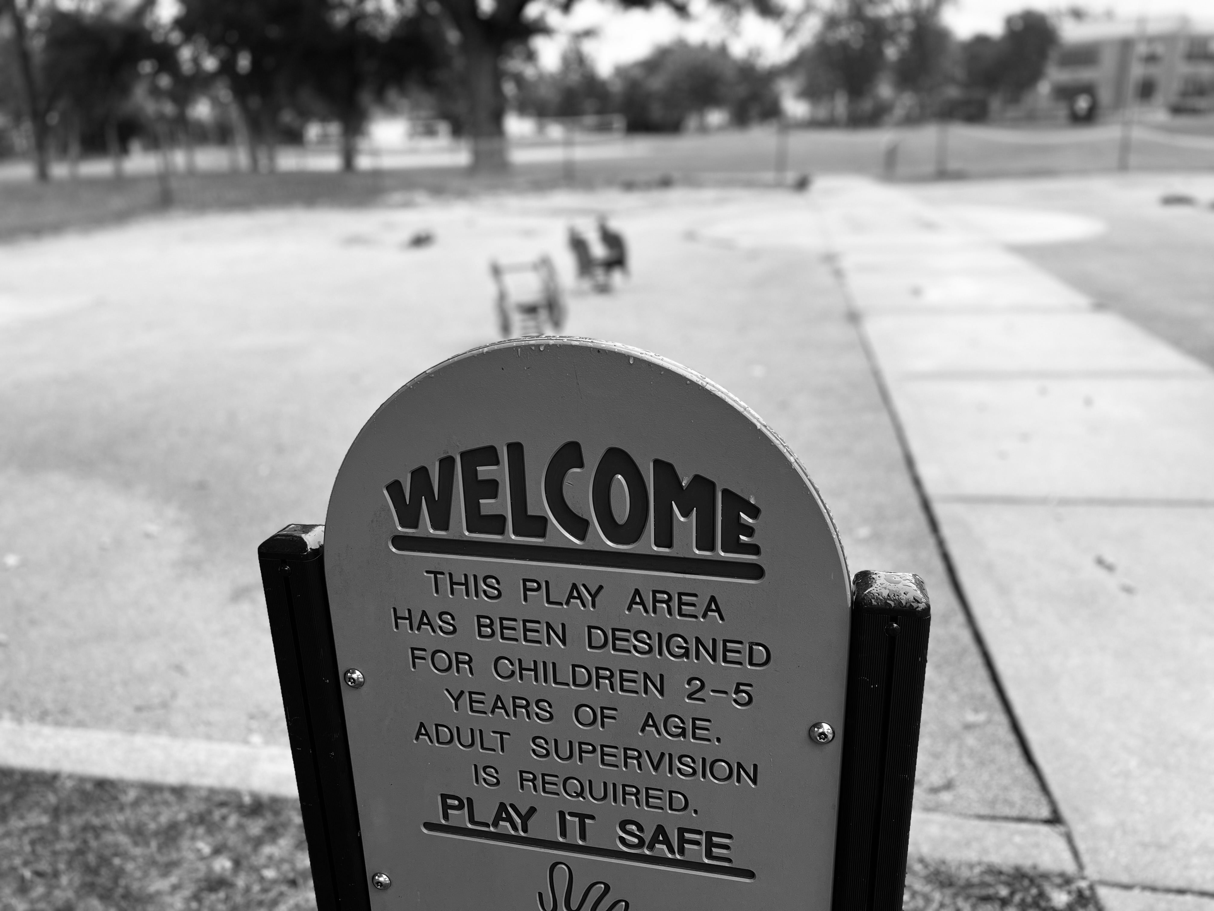 a sign welcoming people to a playground that's closed