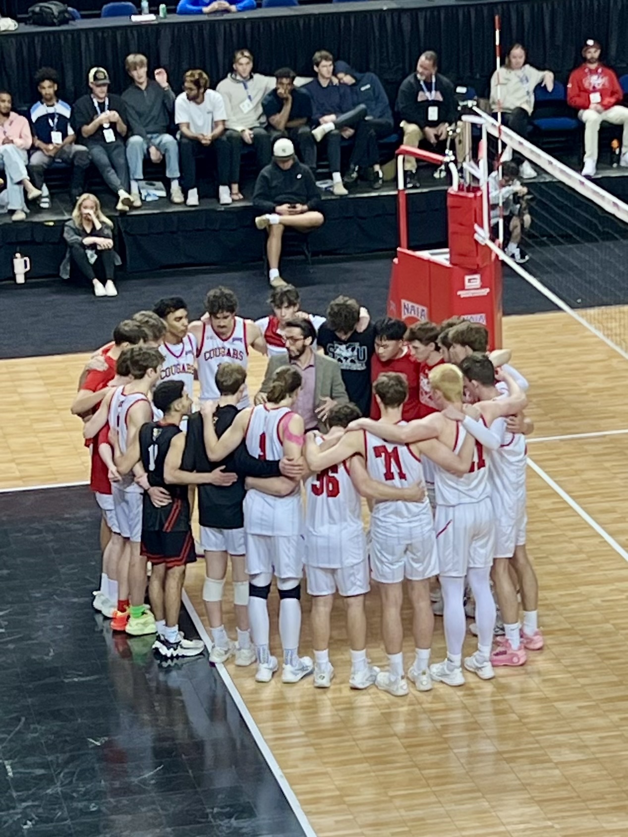 Danny and the rest of the Cougars gather on court after losing in the national championship